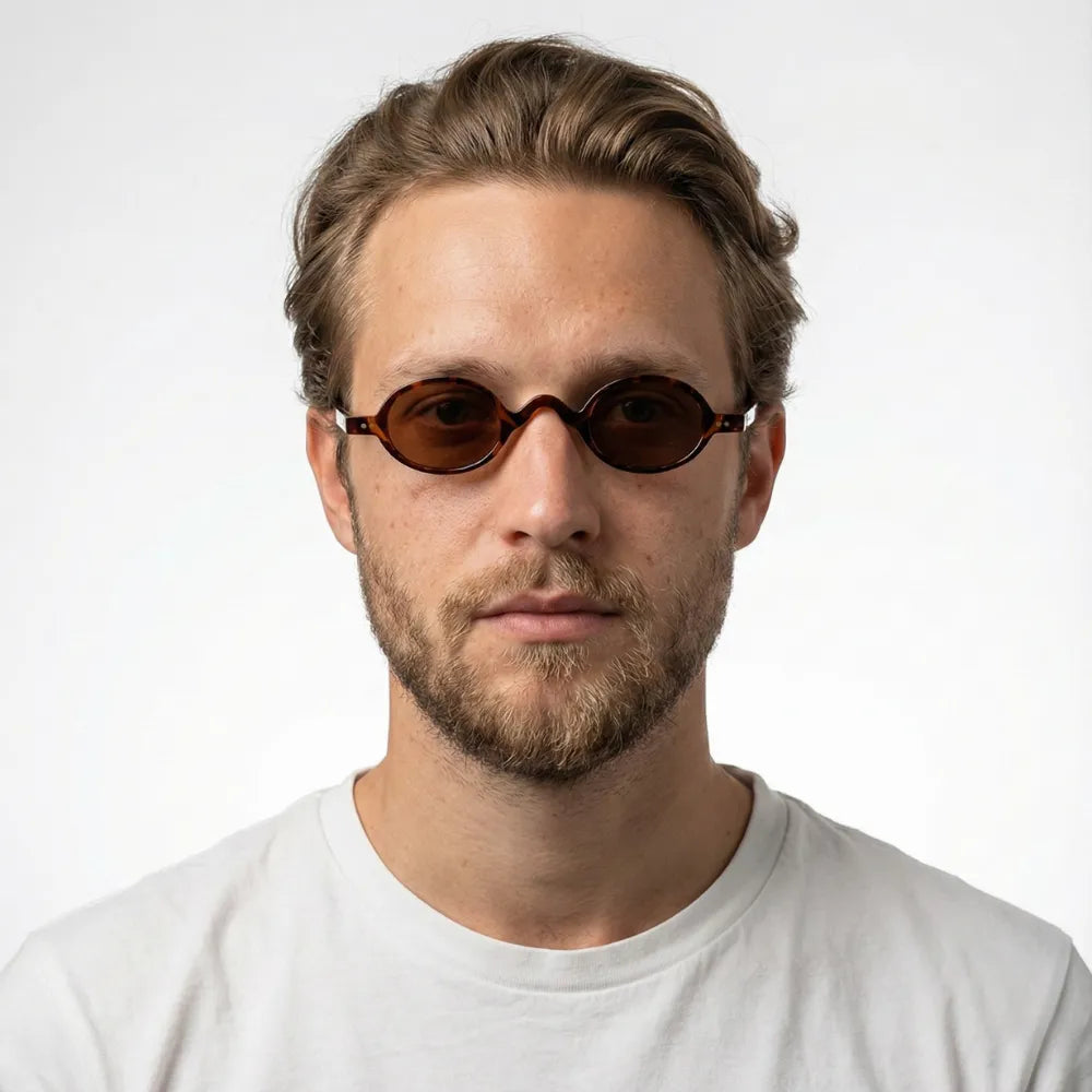 Small rectangular sunglasses worn outdoors — HARO Beaulieu Kérylos lifestyle